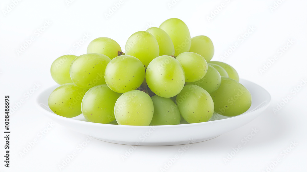 bunch of fresh green grapes on white plate, isolated on white background. grapes look juicy and delicious, perfect for healthy snack. bunch of fresh green grapes on white plate, isolated on white background. grapes look juicy and delicious, perfect for healthy snack.