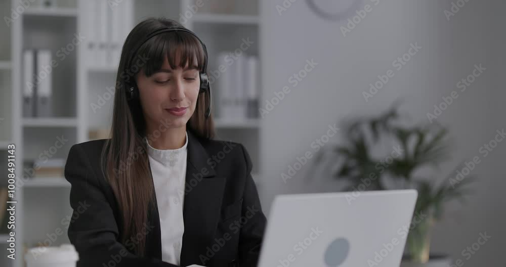 Young beautiful woman working at her workplace in office builder. Young beautiful woman working at her workplace in office builder.