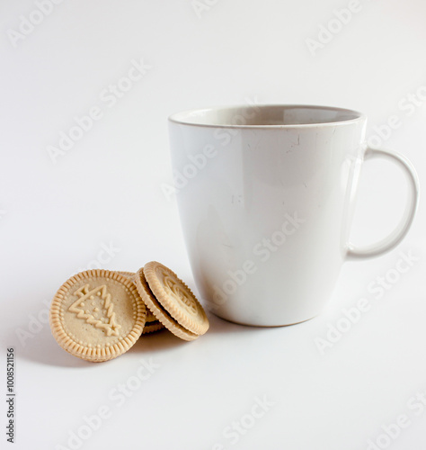 Cup of coffee with Round  Christmas cookies. Vanilla or butter sandwich cookies.