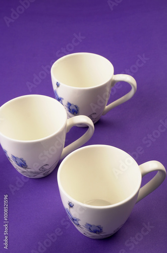 Wallpaper Mural Top view of colorful working table have Headphones,mobile phone and cup of tea on color blue, Yellow and pink background for create idea for business or design. Relax time listen song (flat lay). Torontodigital.ca