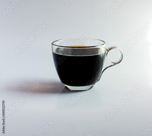 black drip coffee in glass cup  white background.