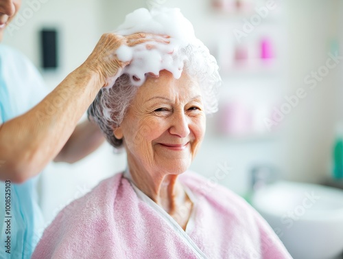  Nursing home residential care concept. A joyful elderly woman enjoying a hair wash in a nursing home salon, a moment of selfcare and pampering, personal grooming. photo