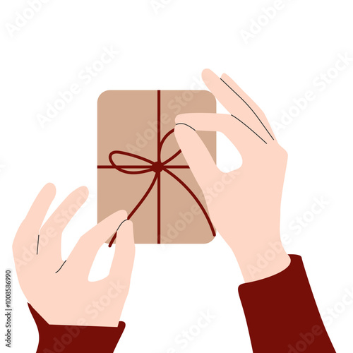 Holiday wrapping. Close up of hands tying a bow on gift with Christmas background. Gift-wrapping services or products