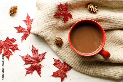 Hot chocolate drink in a red cup. Autumn Winter composition