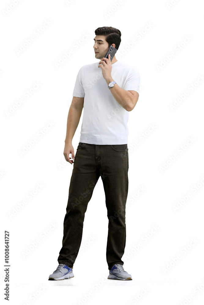 Naklejka premium A man, full-length, on a white background, talking on the phone