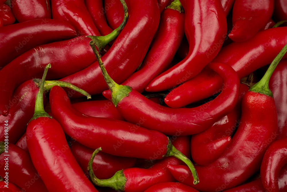 Fresh Red Chilli Peppers background. Vivid colour close up photograph. Top view. Fresh Red Chilli Peppers background. Vivid colour close up photograph. Top view.