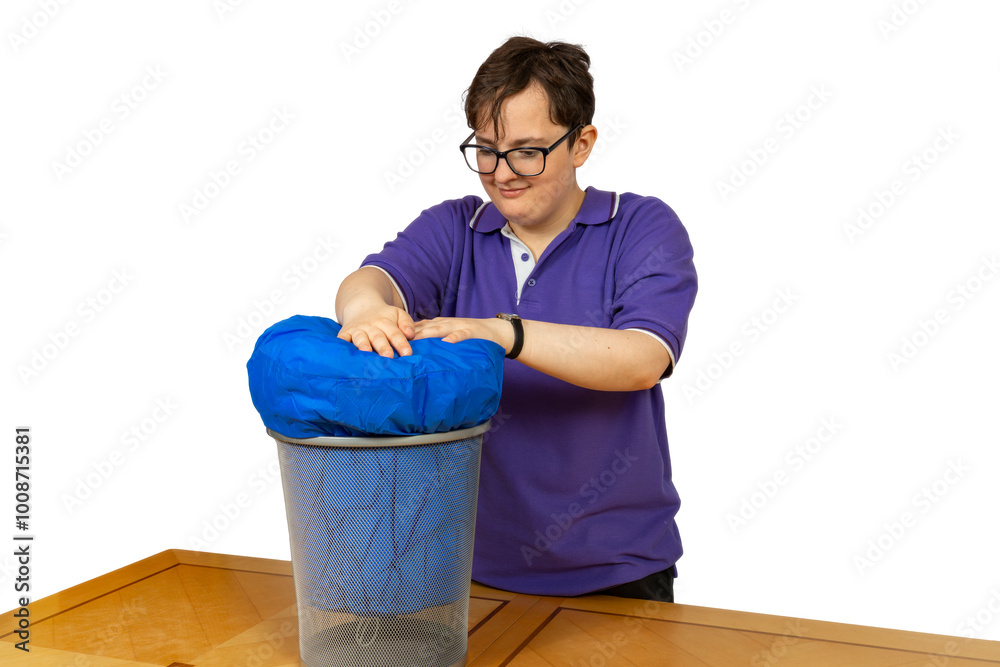 Photo & Art Print Young student stuffs blue sleeping bag into