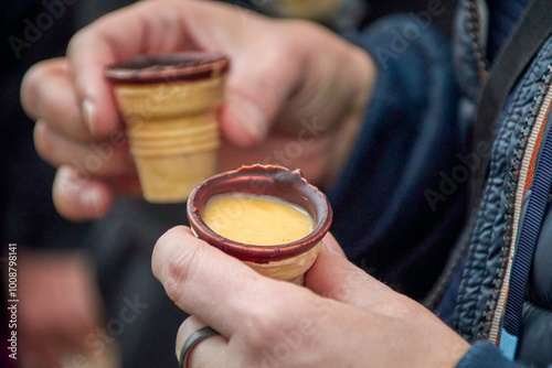 two chocolate waffle cups filled with egg liqueur