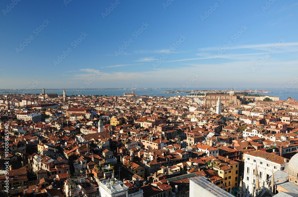 Aerial view of Venice's iconic architecture and canals under a clear blue sky Aerial view of Venice's iconic architecture and canals under a clear blue sky