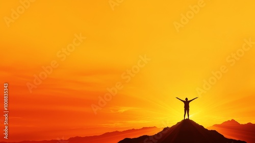 Person celebrating success on mountaintop during sunset with arms raised.