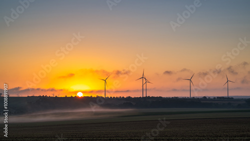 A view of a wind turbine at sunset in Allstedt in saxony anhalt