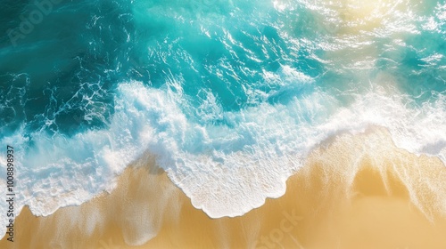 High-altitude image of turquoise water with sunlight reflecting off the waves and a golden sandy beach