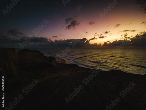 a sunrise with clouds, Beach, Tropical climate, Summer Climate - Photo at Praia da Pipa - RN, Brazil photo