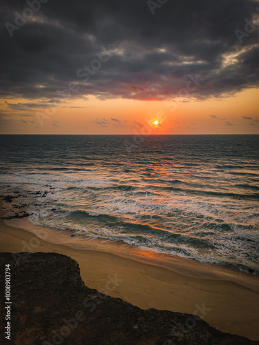 sunrise with clouds, Beach, blue sky, nature, mountain, cliffs, Tropical climate, Summer climate, Dramatic clouds - Photo in Praia da Pipa - RN, Brazil photo