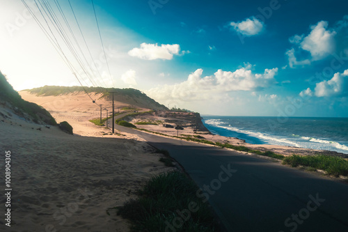 Beach seen from the top of the mountain, blue sky, nature, mountain, cliffs, Tropical climate, summer climate, beach day - Photo in Praia da Pipa - RN, Brazil photo