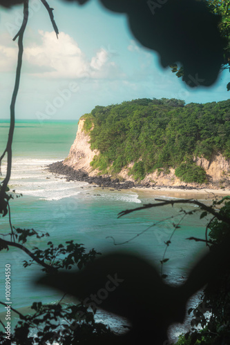 Beach seen from the top of the mountain, blue sky, nature, mountain, cliffs, Tropical climate, summer climate, beach day - Photo in Praia da Pipa - RN, Brazil photo