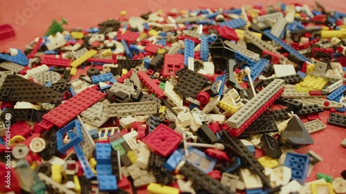Loads of colourful old plastic bricks to build a toy, in France