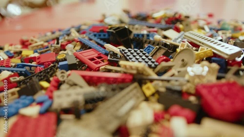 Loads of colourful old plastic bricks to build a toy, in France