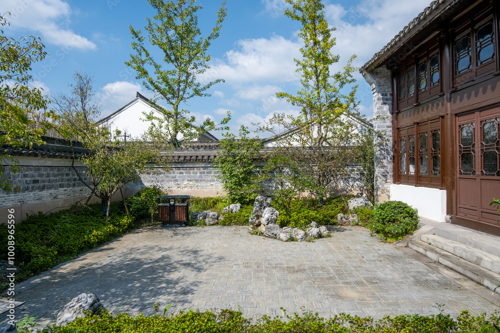 Background texture of a serene traditional Chinese garden featuring a spacious courtyard or backyard with a paved floor in a park. Copy space for design. Background texture of a serene traditional Chinese garden featuring a spacious courtyard or backyard with a paved floor in a park. Copy space for design.