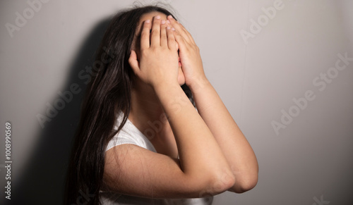 Teenager girl with depression sitting alone