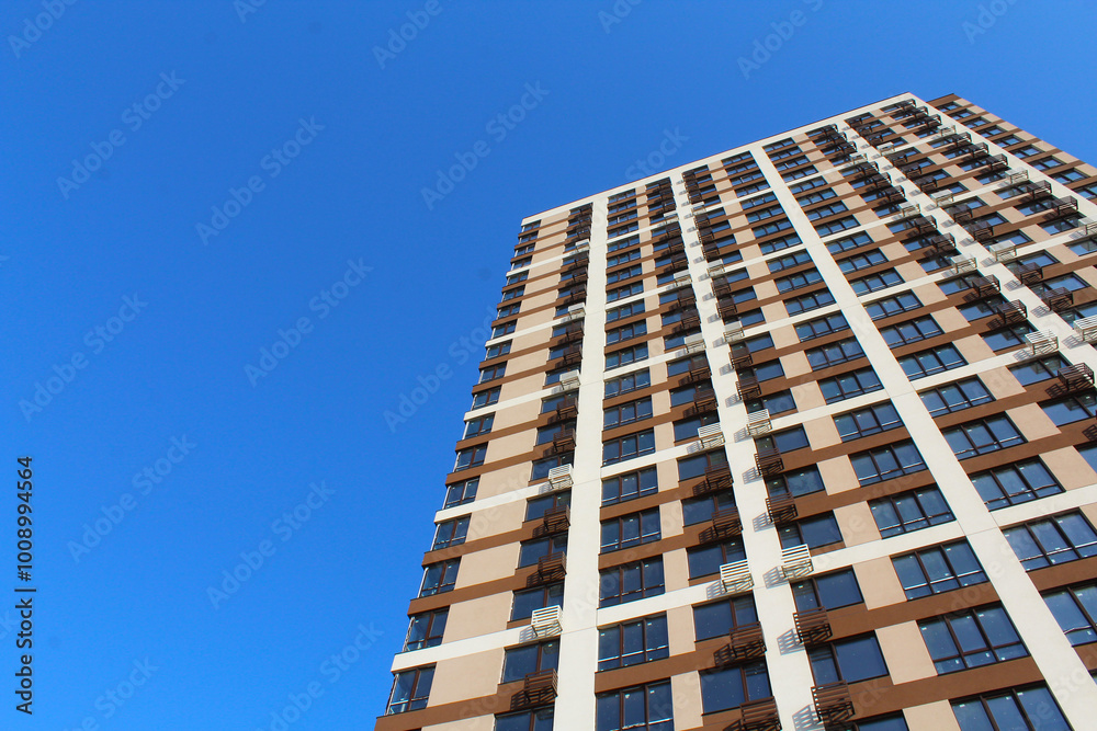 the facade of the new building against the blue sky the facade of the new building against the blue sky