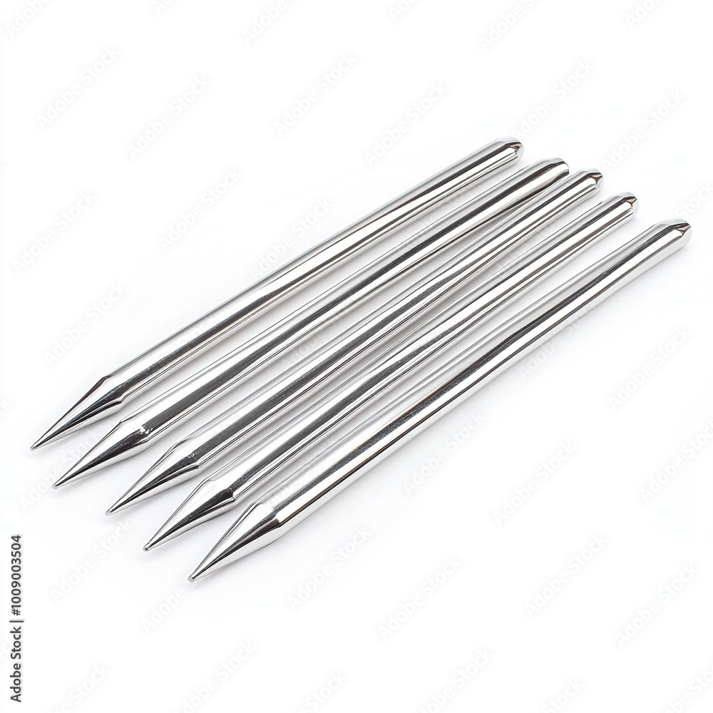 A set of five metal skewers, pointed at one end, used for grilling or cooking. A set of five metal skewers, pointed at one end, used for grilling or cooking.