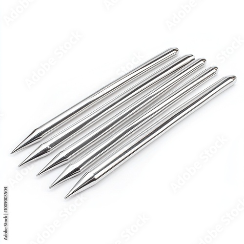 A set of five metal skewers, pointed at one end, used for grilling or cooking.