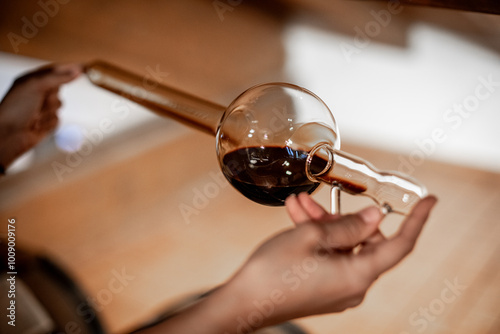 The decanting of balsamic vinegar is traditionally done with a glass instrument that in addition to decanting allows for quality control.