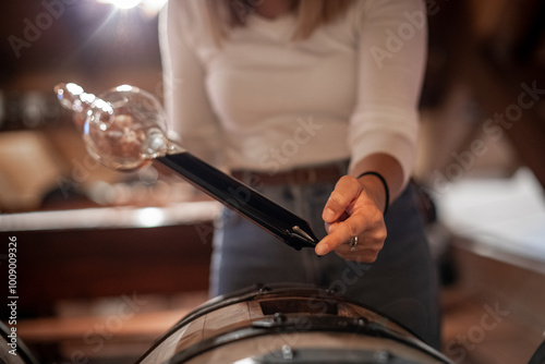 Schilderij op canvas The decanting of balsamic vinegar is traditionally done with a glass instrument that in addition to decanting allows for quality control