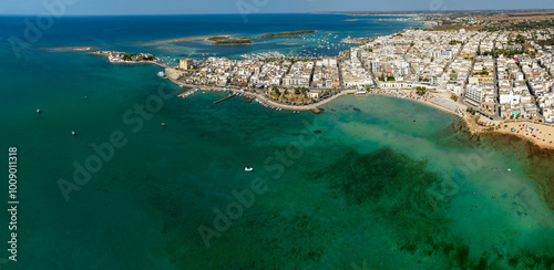 Panoramic aerial view Porto Cesareo, a small city on the Mediterranean Sea in the province of Lecce in Puglia, Italy. It is a tourist town located on the Ionian coast of the Salento peninsula.