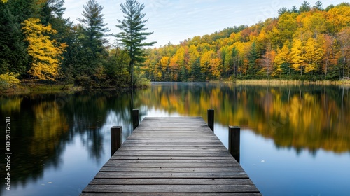 Serene autumn reflection at a tranquil lakeside dock