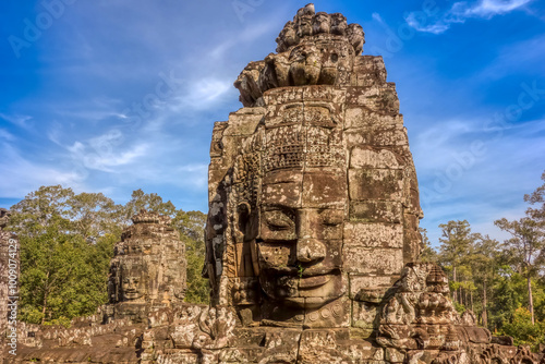 Sculpted faces on the bayon temple in angkor thom- angkor wat archaeological park, siem reap, cambodia.