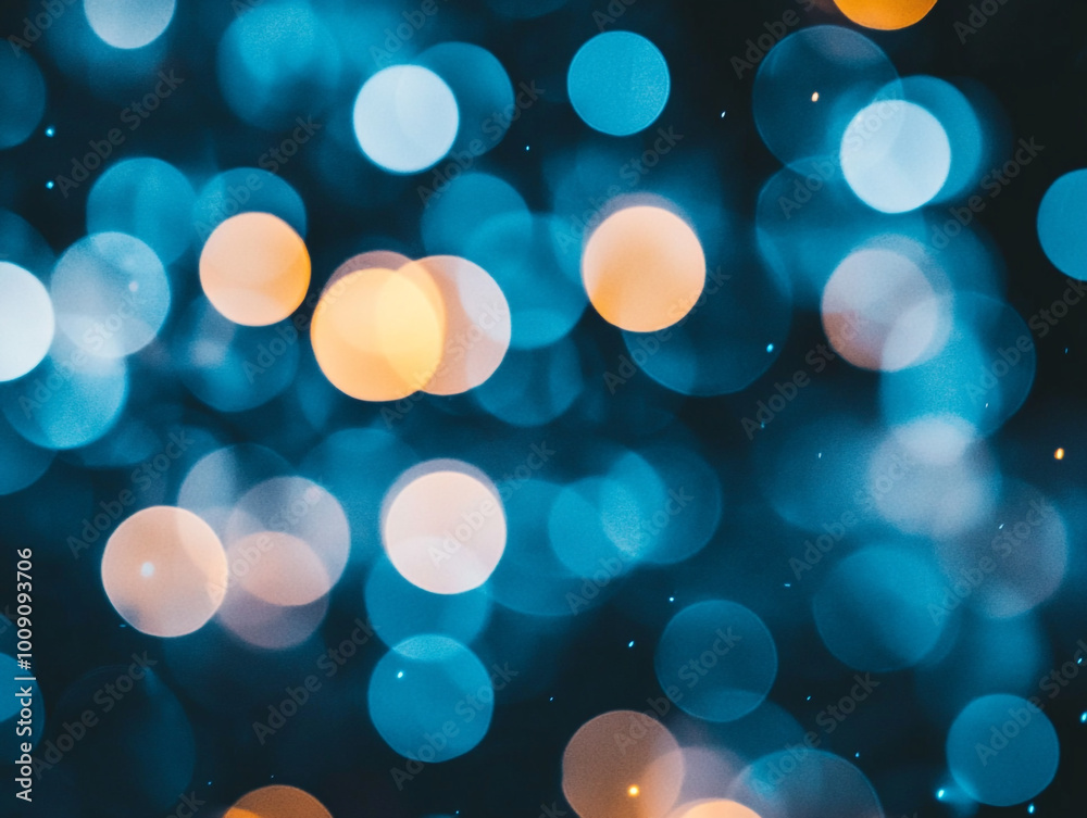 Blurred light blue circles on a dark background. Abstract bokeh lights. Blurred light blue circles on a dark background. Abstract bokeh lights.