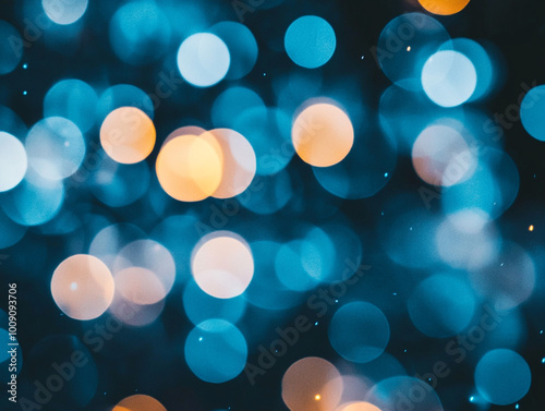 Blurred light blue circles on a dark background. Abstract bokeh lights.