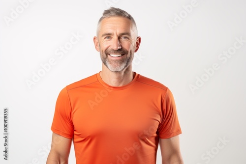 Portrait of a joyful man in his 40s wearing a moisture-wicking running shirt isolated on white background