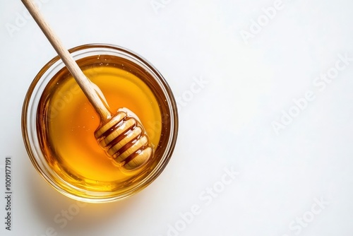 Glass bowl of honey with honey dipper isolated on white background. top view - generative ai