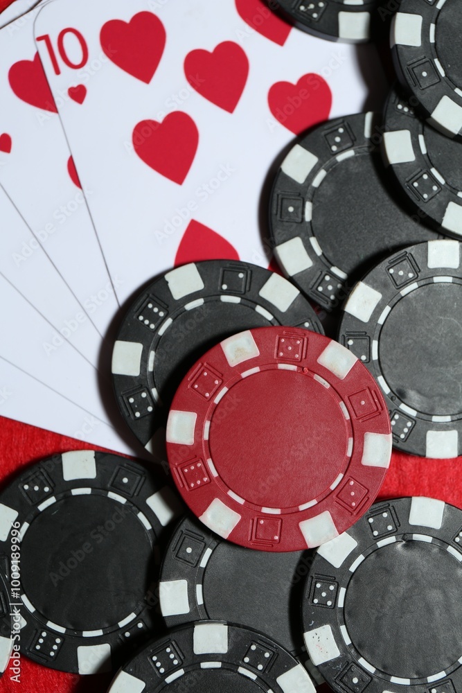 Playing cards and poker chips on table, flat lay Playing cards and poker chips on table, flat lay