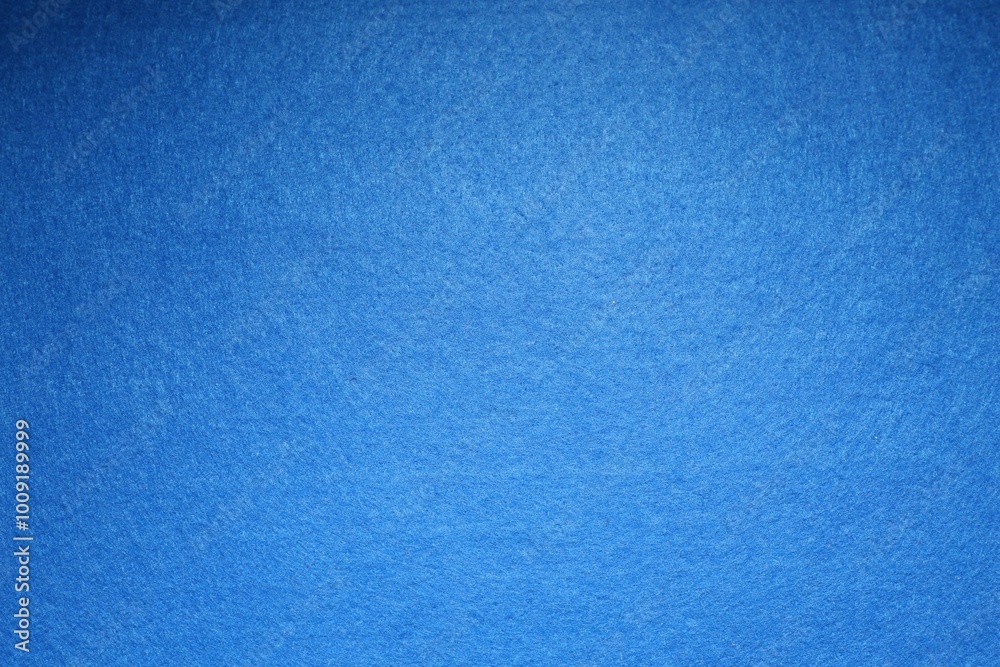 Naklejka premium Blue textured surface as background, top view