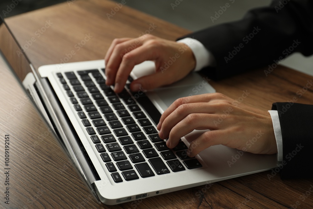 Businesswoman using laptop at wooden table indoors, closeup. Modern technology Businesswoman using laptop at wooden table indoors, closeup. Modern technology