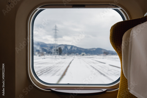 Obraz na płótnie Traveling to Akita, Japan. View of winter scenery from train w salonie