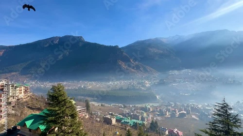 colorful prayer flags on metal bridge at Manali, Himachal Pradesh, IndiaBeas river manali close up with selective focus and blur.