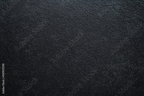 Dark gray background with fine grainy texture, space for text