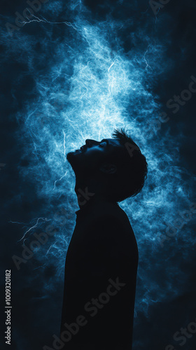 Silhouette of a person surrounded by vibrant blue lightning bolts in a dark background, symbolizing energy and power at nighttime photo