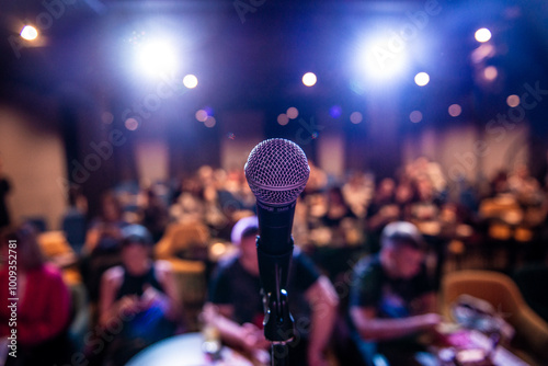 Microphone on the stand. View from the stage to the hall. Safits. Viewers out of focus