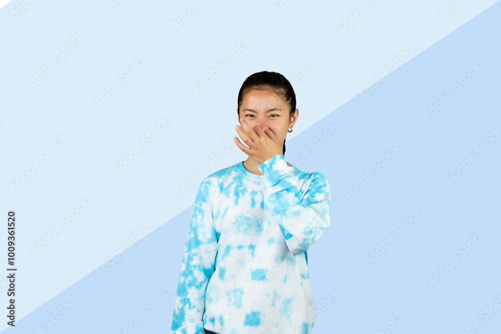 Young Asian Girl in blue dress disgust happy expression and face gesture pointing Young Asian Girl in blue dress disgust happy expression and face gesture pointing