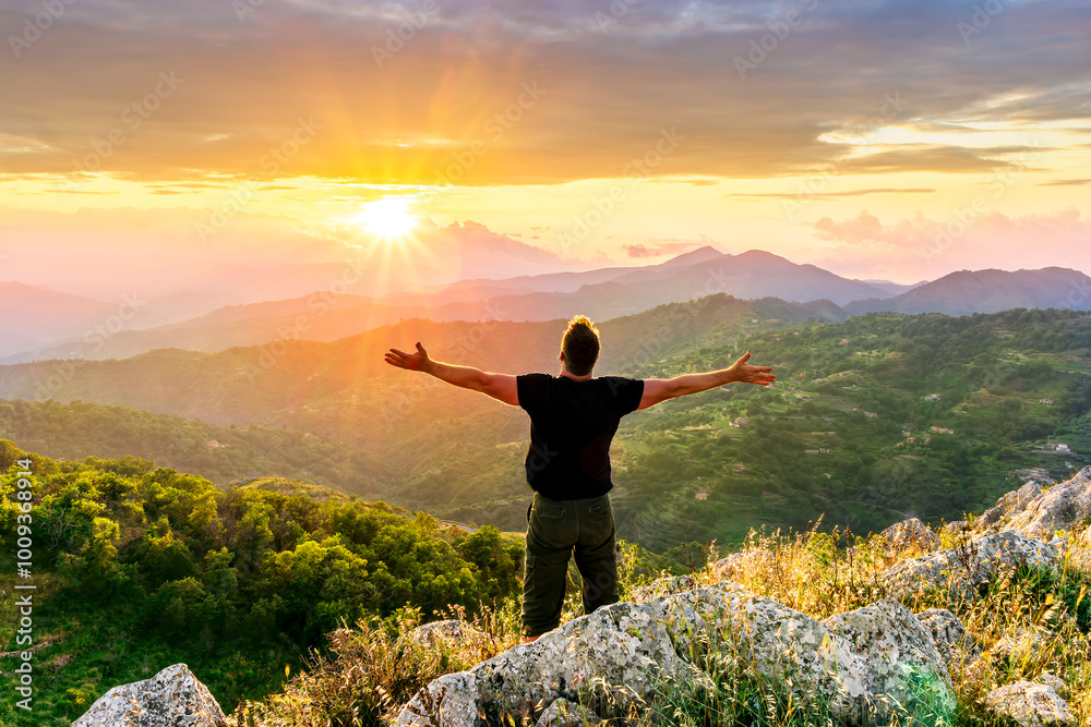 happy man watching amazing highland evening sunset, person delight with nature landscape happy man watching amazing highland evening sunset, person delight with nature landscape