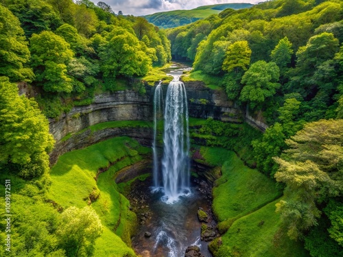 Majestic Henrhyd Waterfall Cascading Through Lush Greenery in the Heart of Wales' Natural Landscape photo