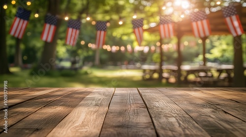 Wooden table with a peaceful park in the background, filled with American flags and sunny skies photo