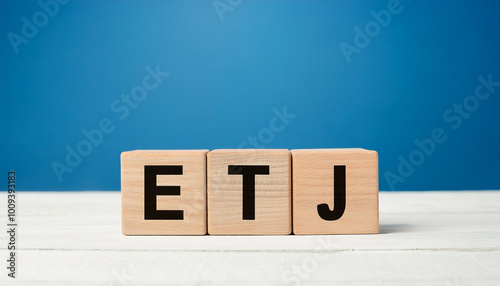 Wooden cubes with abbreviation ETJ. Extraterritorial Jurisdiction. English Teaching Jobs. Close-up.