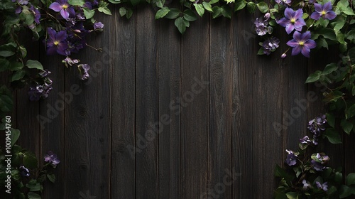 Purple flowers and green leaves border a dark wooden background.